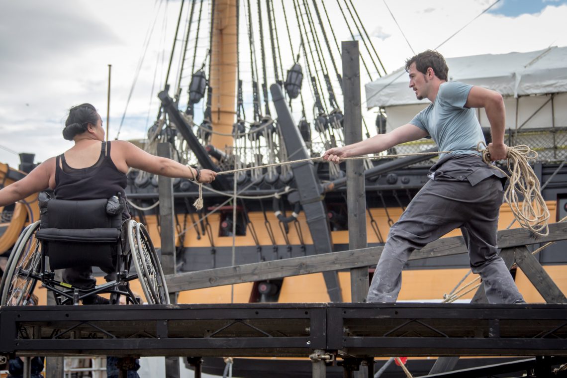 Live outdoors performance of The Seafarers. Two dancers, joined by a rope they hold and suspend between them
