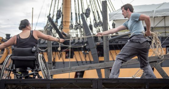 Live outdoors performance of The Seafarers. Two dancers, joined by a rope they hold and suspend between them