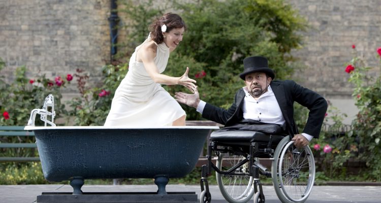 Dave and Lucy in a bathtub during an outdoor performance of Bill and Bobby.