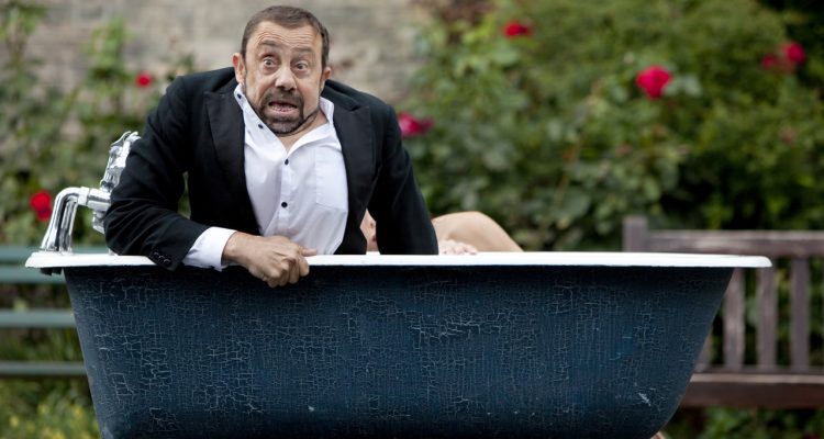 Dave and Lucy in a bathtub during an outdoor performance of Bill and Bobby.