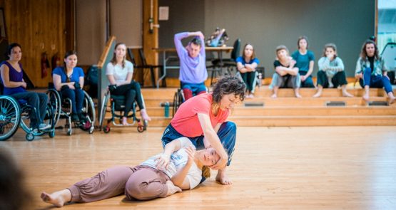 Lucy dancing with Hannah on the studio floor.