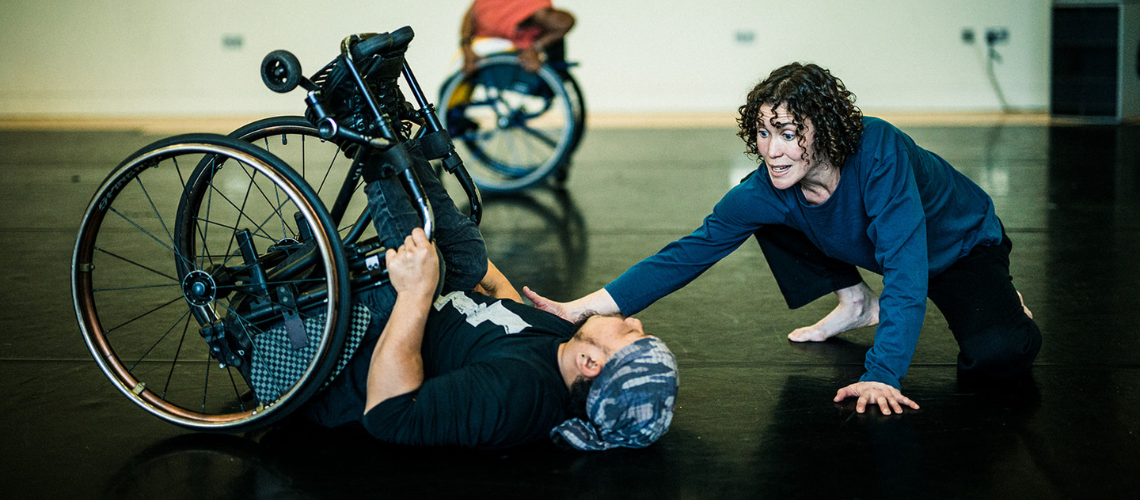 Amy Butler and wheelchair dancer Nadenh Poan working in the studio together.