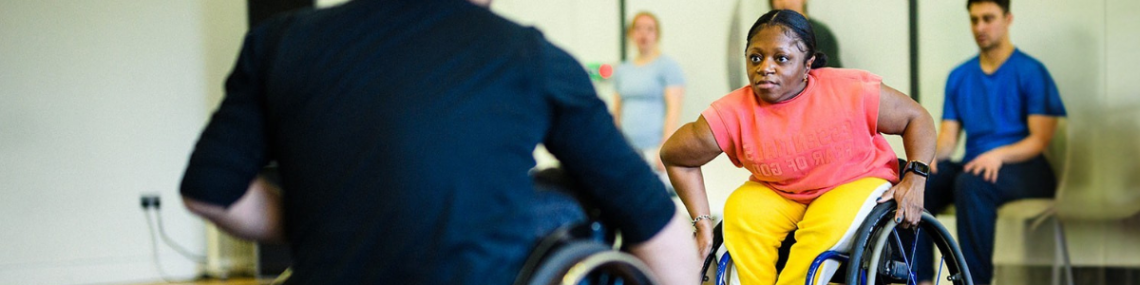A black wheelchair dancer in the studio.